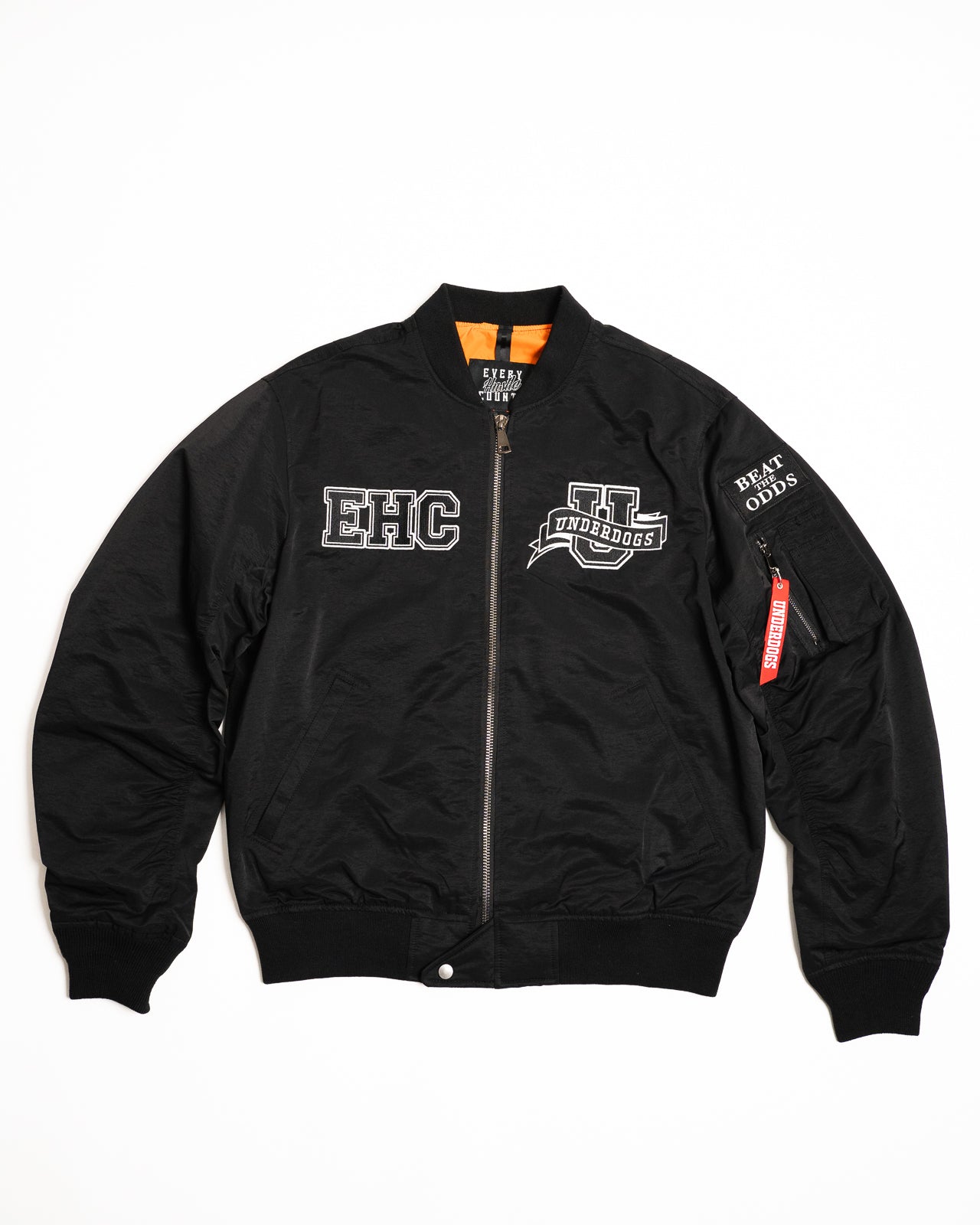 Every Hustle Counts EHC Underdogs black bomber jacket, front view with EHC chest patches