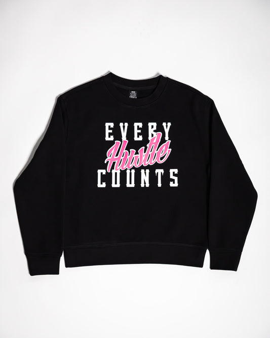 Every Hustle Counts black kids crew neck sweatshirt with pink script chest print, flat lay